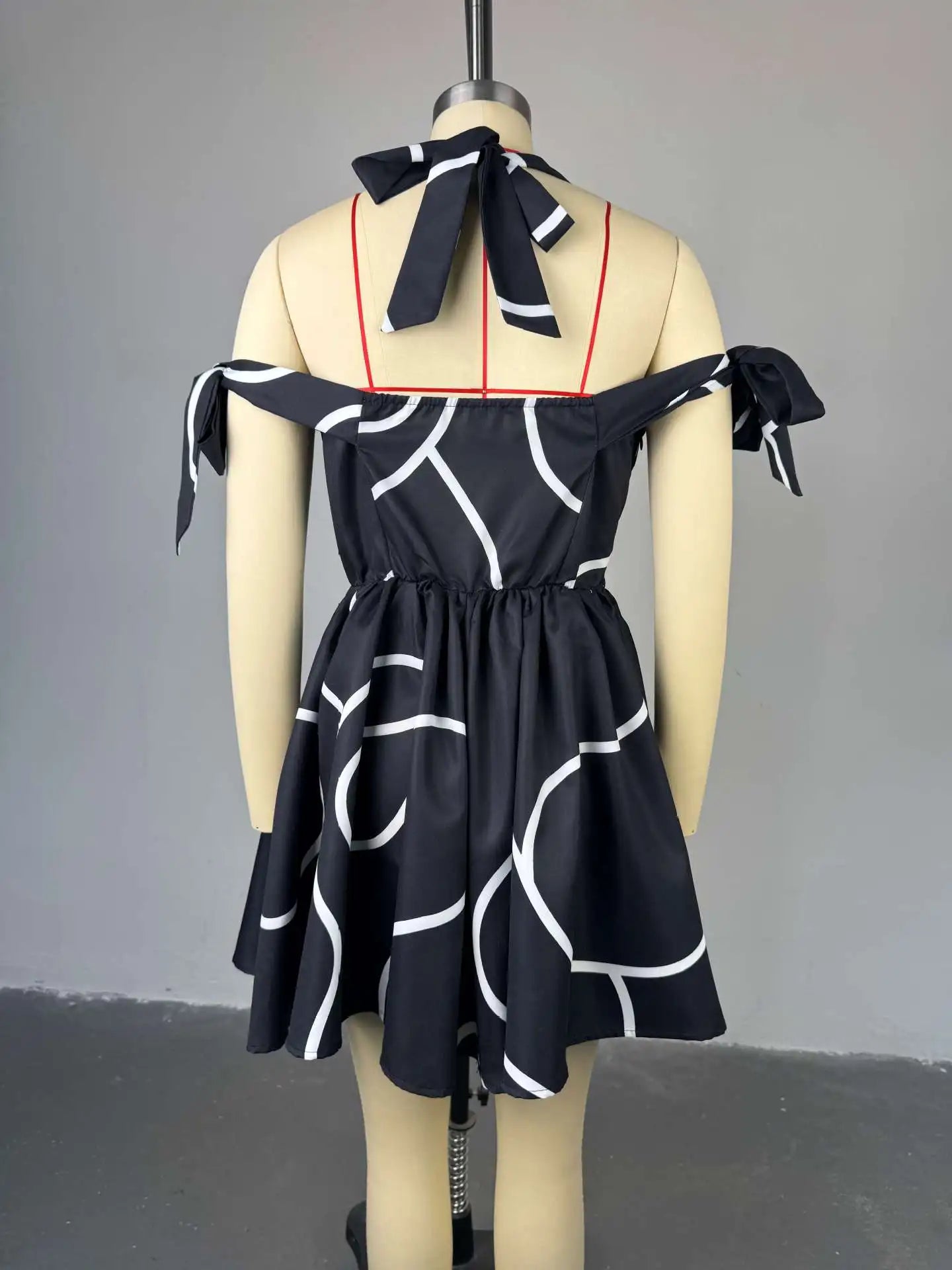 UNIKCOSA™ 2025 Summer Bowknot Halter Dress – Women’s Geometric Striped Swing Dress | Elegant Streetwear & Party Outfit