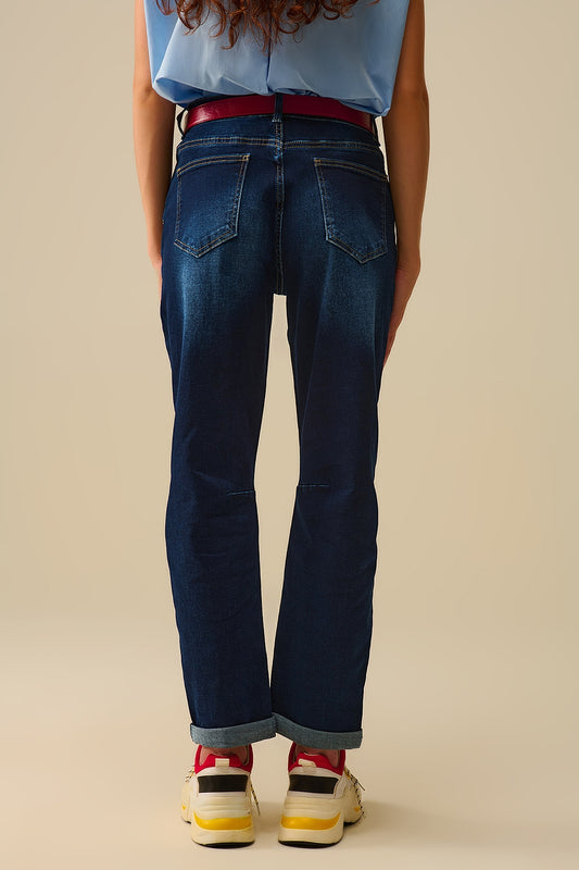 Dark wash jeans with contrast stitching and cuffed hems