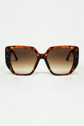 Brown pin-up style sunglasses with geometric design and cat eyes