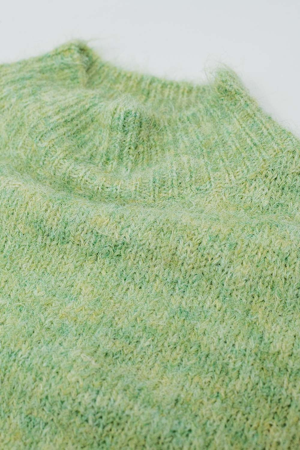 Fluffy light green sweater with high neck and balloon sleeves