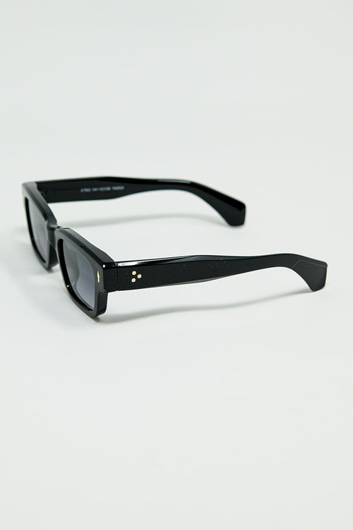 Black sunglasses with oval frame with gold detail — view 2 of 3