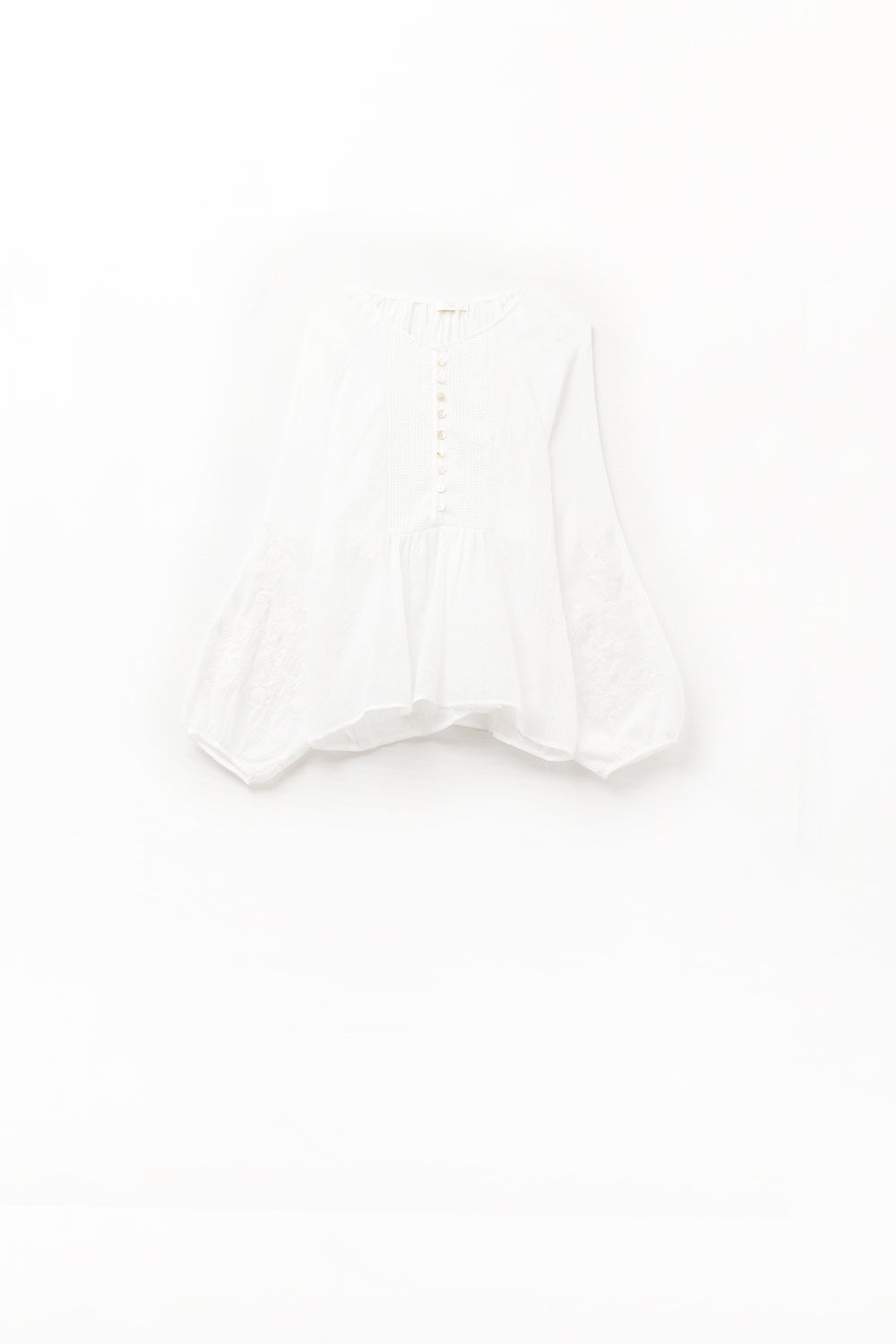 white chiffon blouse with embroidery on the sleeves