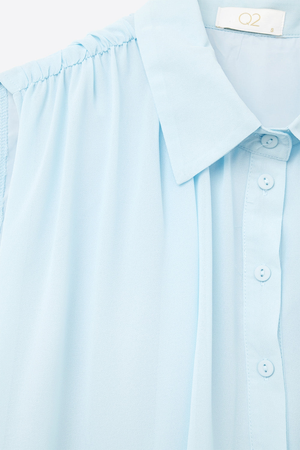 baby blue chiffon blouse with pleats at the hem