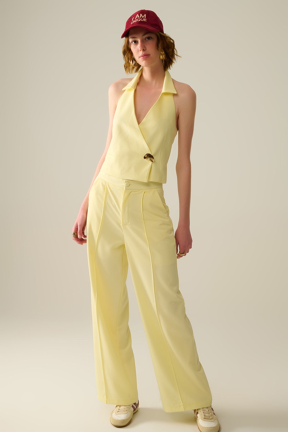 Yellow wrap vest with detailed gold button