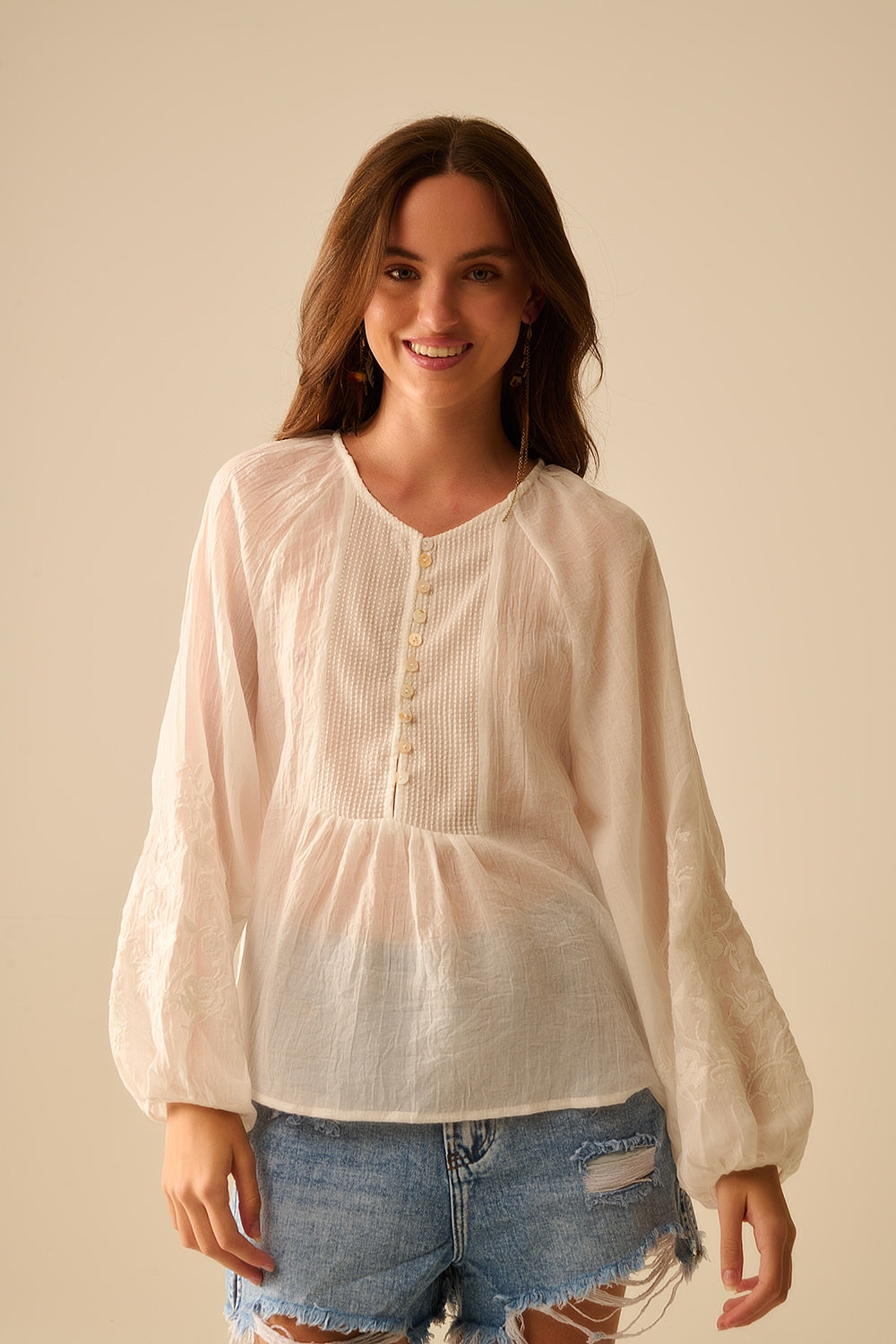white chiffon blouse with embroidery on the sleeves
