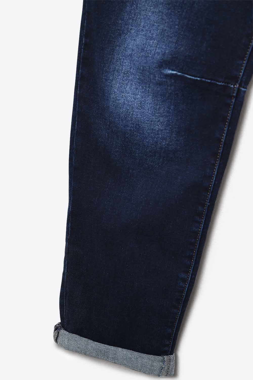 Dark wash jeans with contrast stitching and cuffed hems
