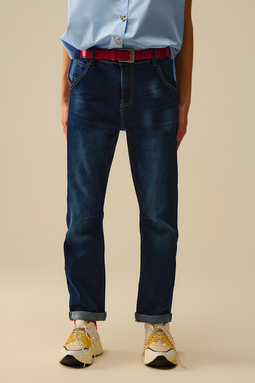 Dark wash jeans with contrast stitching and cuffed hems