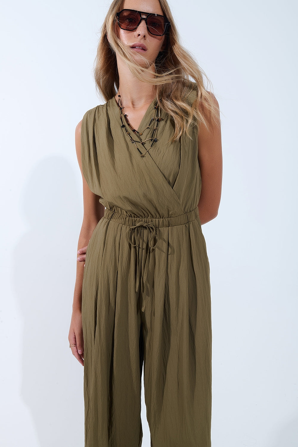 UNIKCOSA draped olive jumpsuit in crinkled fabric