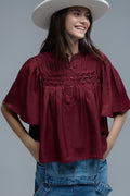 Relaxed wine-colored boho-style blouse with embroidered details