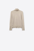 beige turtleneck sweater with gold buttons on the cuff