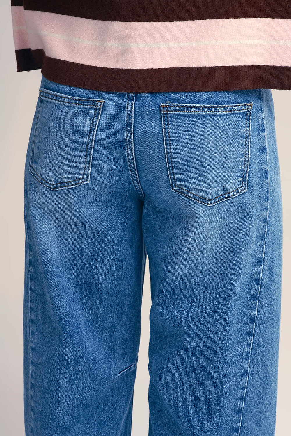 Straight barrel-style jeans with knee stitching detail