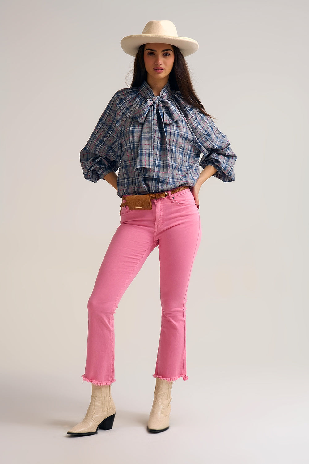 Blue blouse with check print and bow detail at the neck