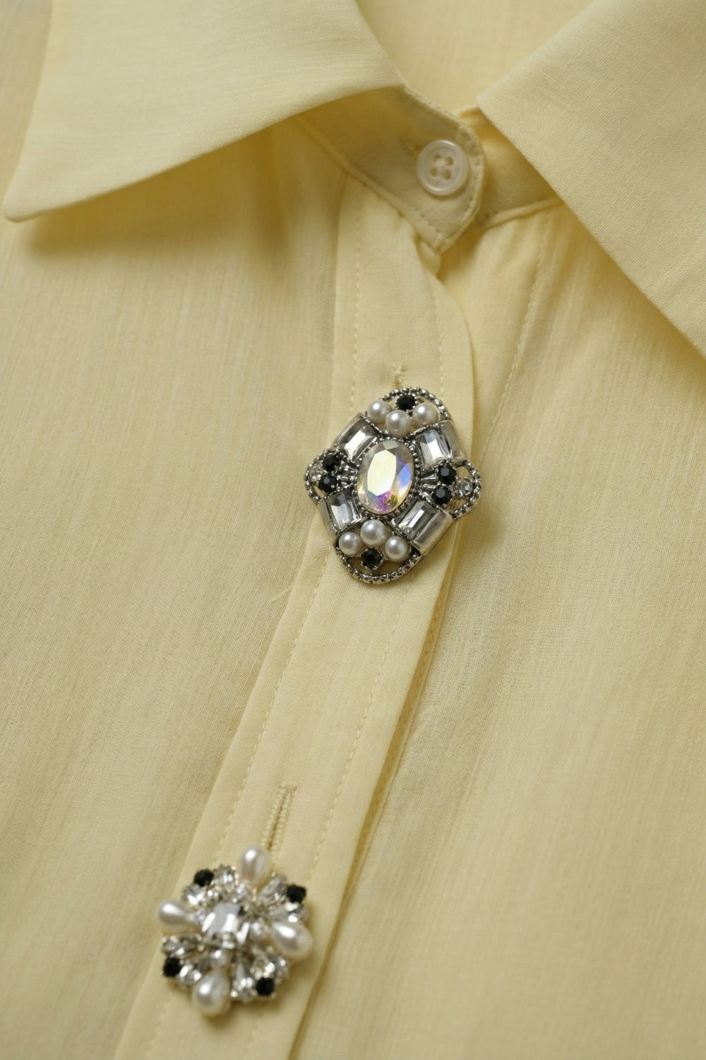 UNIKCOSA Butter Yellow Embellished Button-Down Blouse in tencel fabric