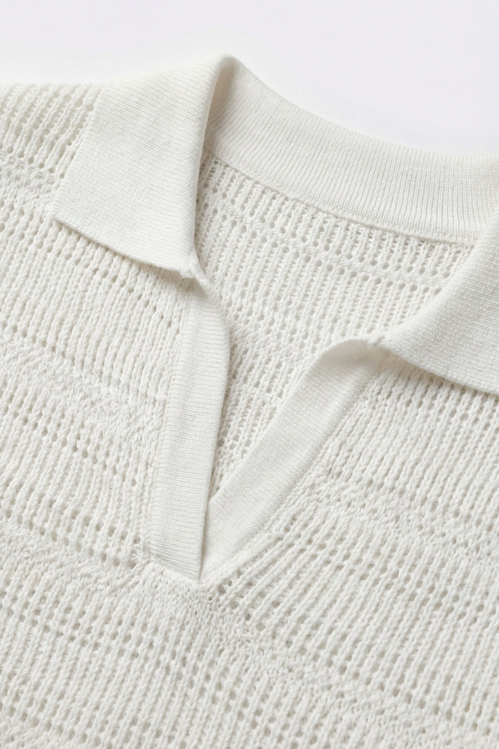 White polo shirt with short sleeves and open knit pattern