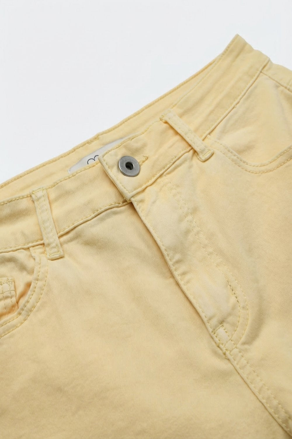 Stretch-denim Bermuda shorts in Butter Yellow