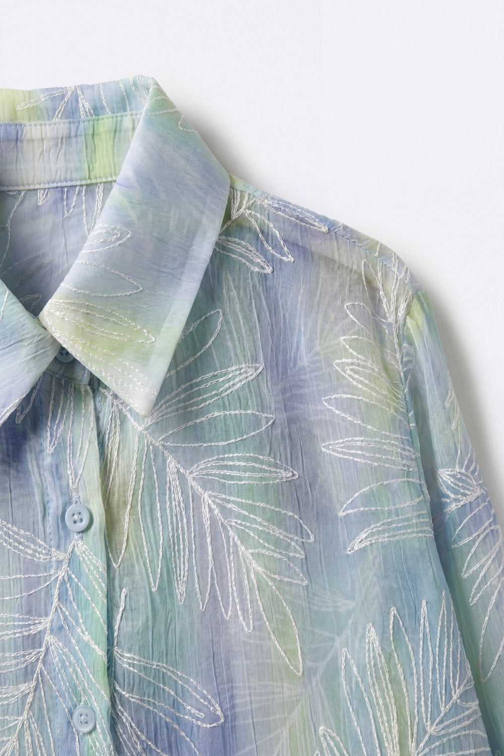 Light Blue Sheer Leaf Print Button-Up Shirt with translucent fabric