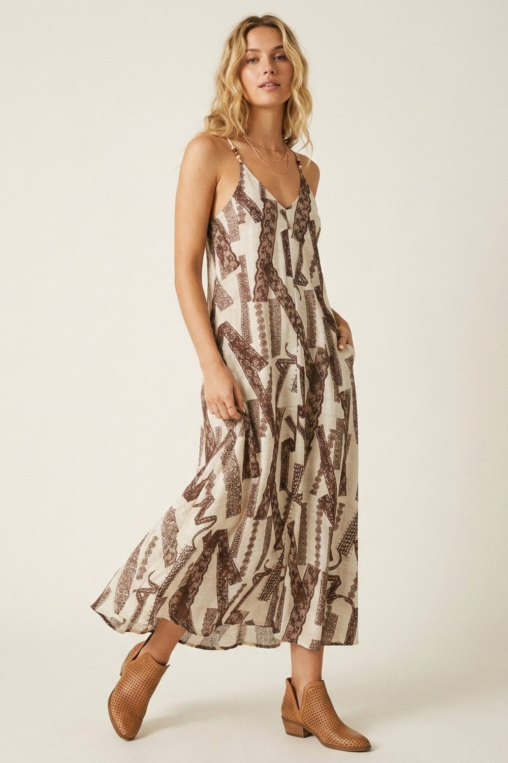 UNIKCOSA Cream and Brown Printed Flowing Maxi Dress