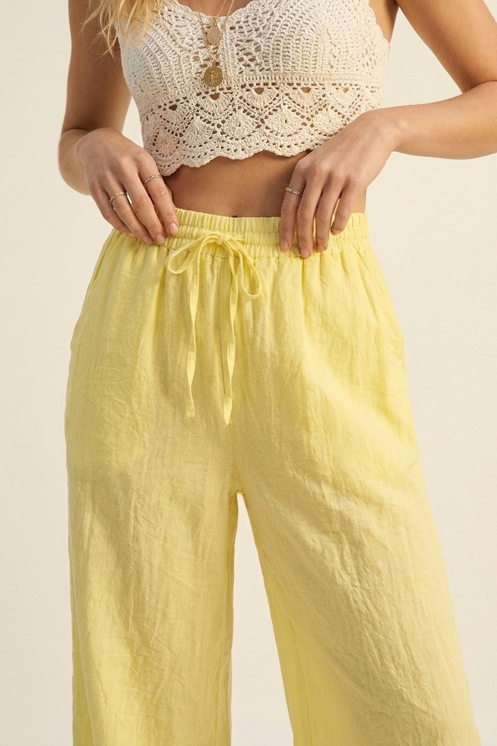 Yellow Wide-Leg Drawstring Pants with sheer fabric