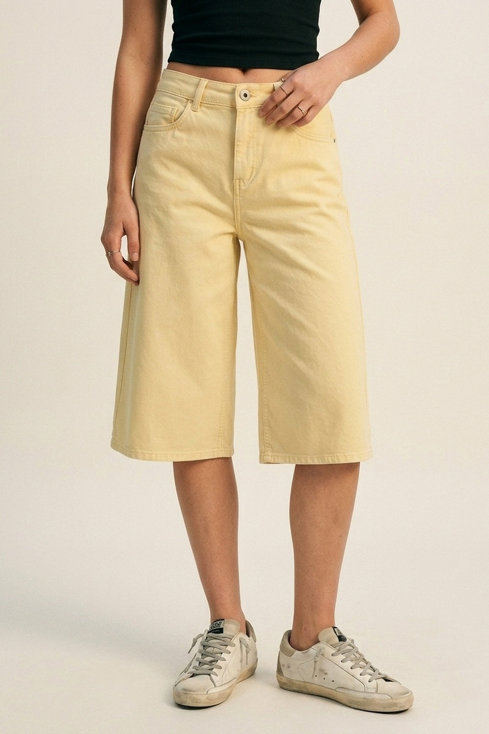 Stretch-denim Bermuda shorts in Butter Yellow