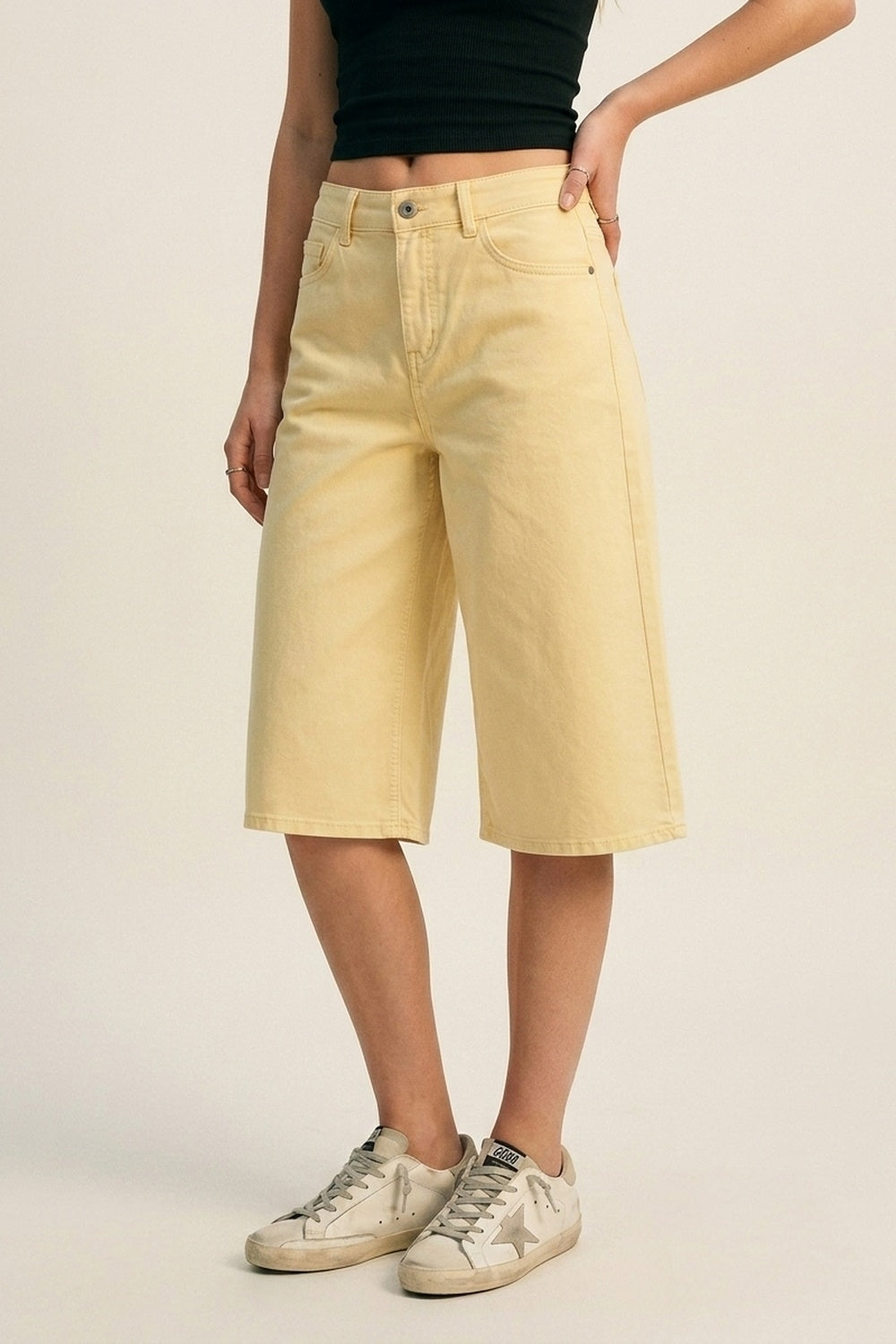 Stretch-denim Bermuda shorts in Butter Yellow
