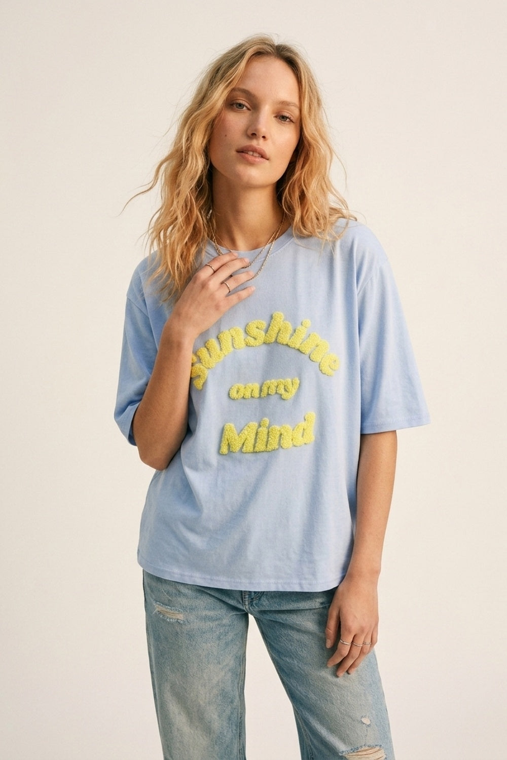 UNIKCOSA Light Blue Relaxed Fit Tee with Yellow Lettering
