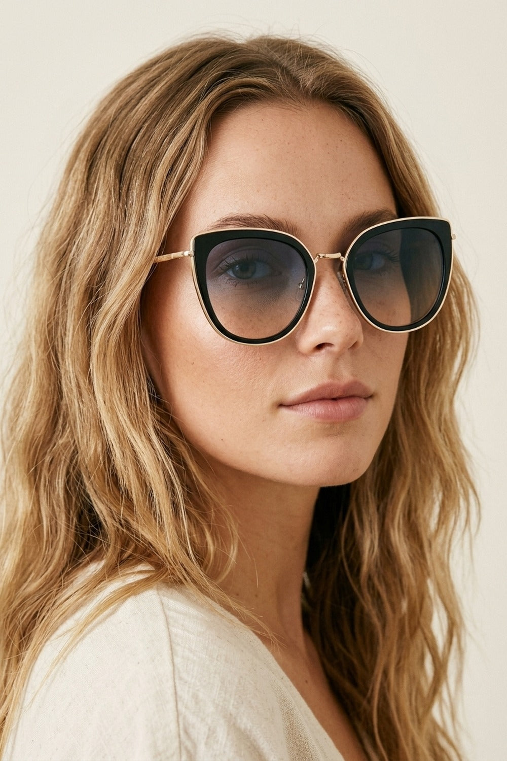 UNIKCOSA Black Gradient Lens Gold Trim Oversize Cat Eye Sunglasses