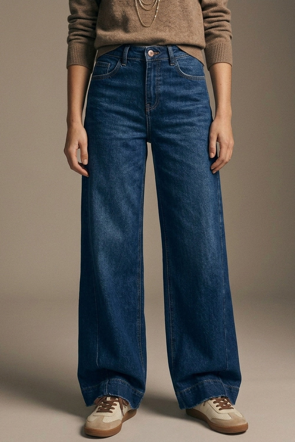 Woman wearing dark-wash extra-wide-leg blue jeans