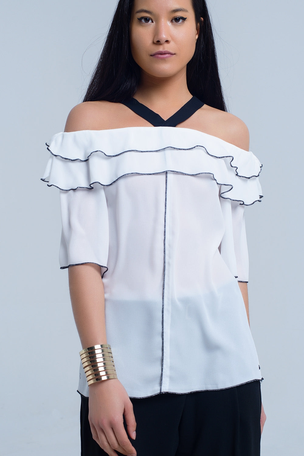White top with black contrast trim