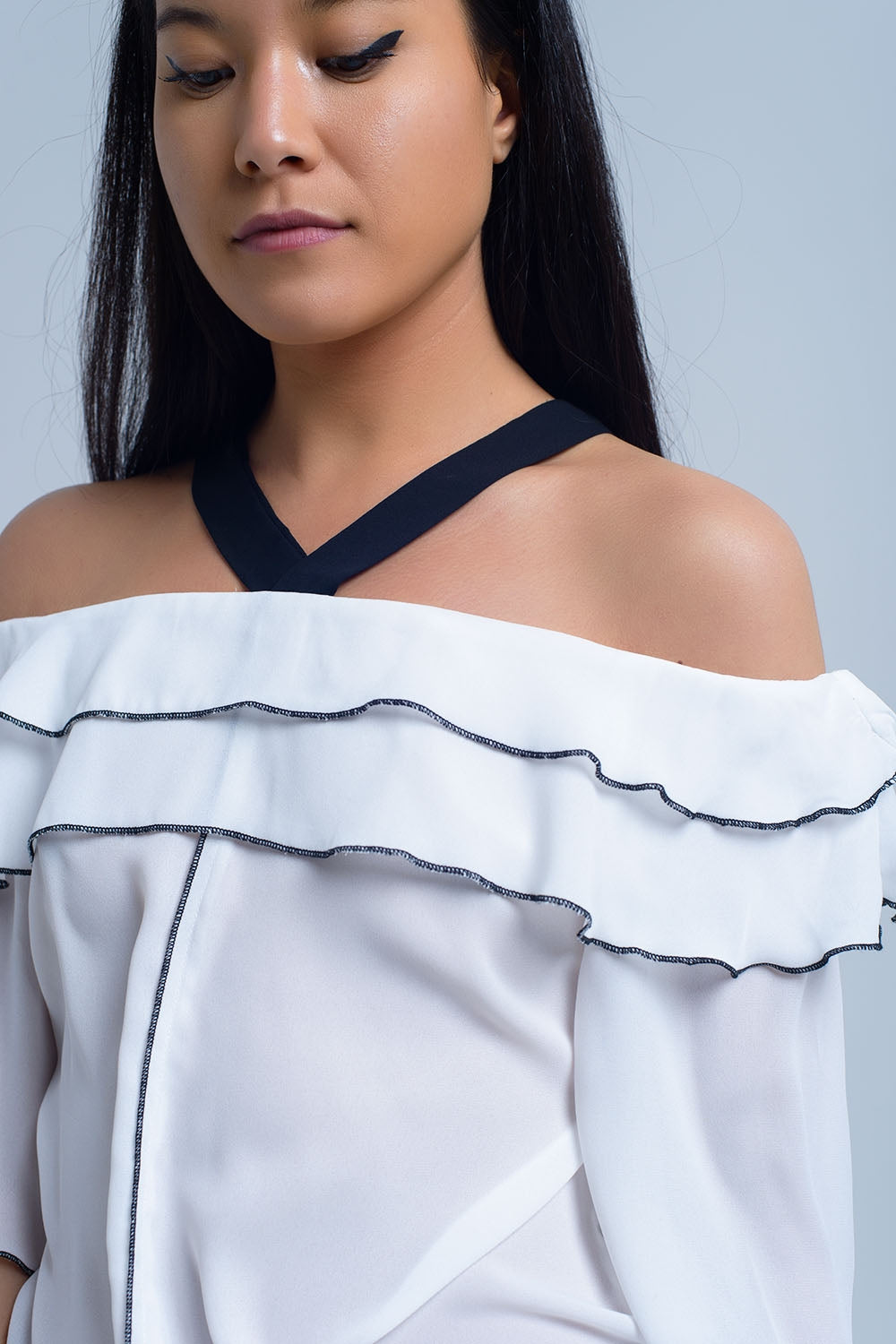 White top with black contrast trim