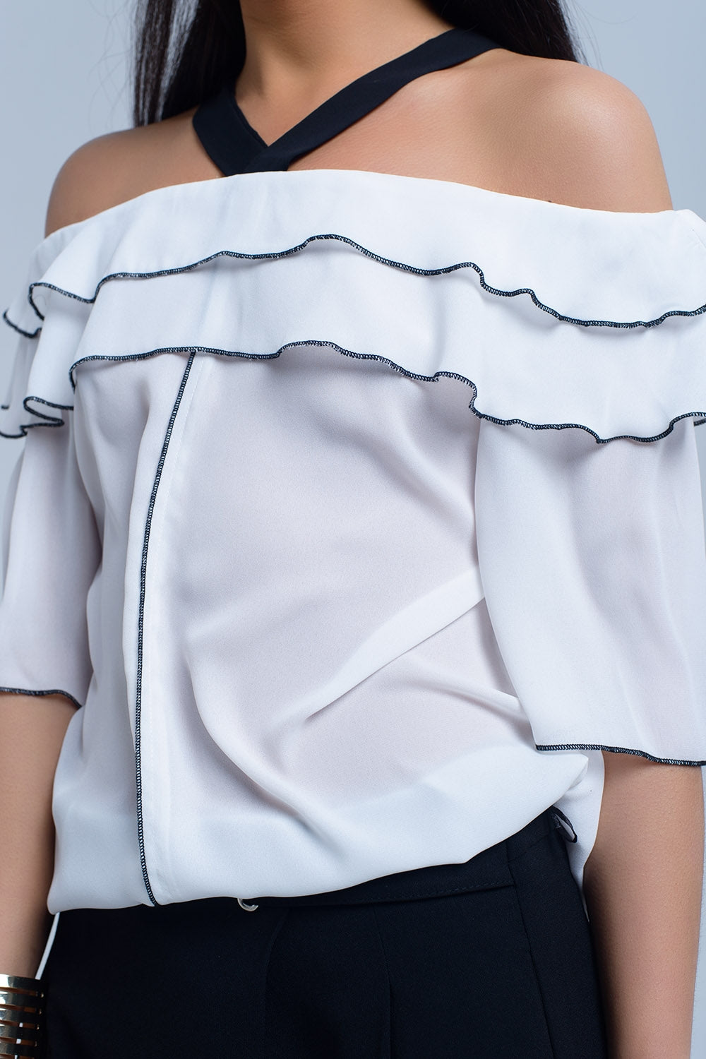 White top with black contrast trim