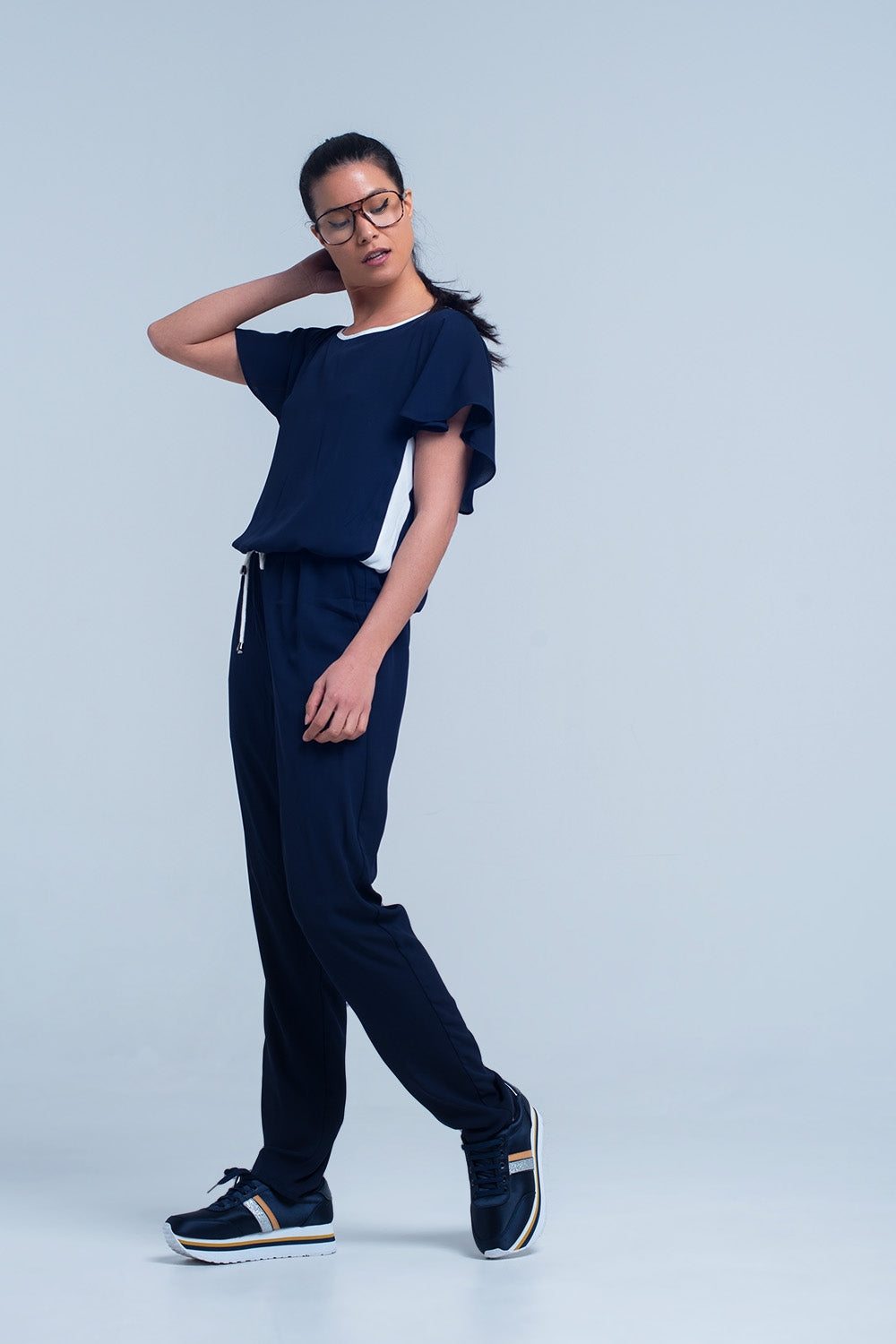 UNIKCOSA Navy blue jumpsuit with short sleeve and ruffle detail