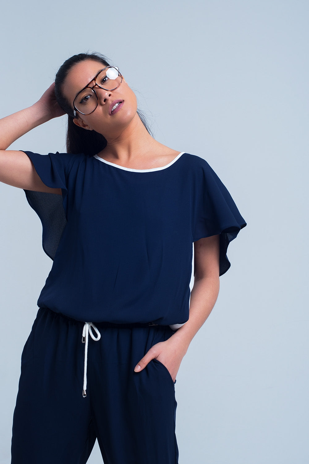 UNIKCOSA Navy blue jumpsuit with short sleeve and ruffle detail