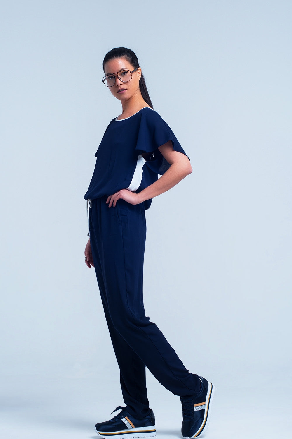 UNIKCOSA Navy blue jumpsuit with short sleeve and ruffle detail