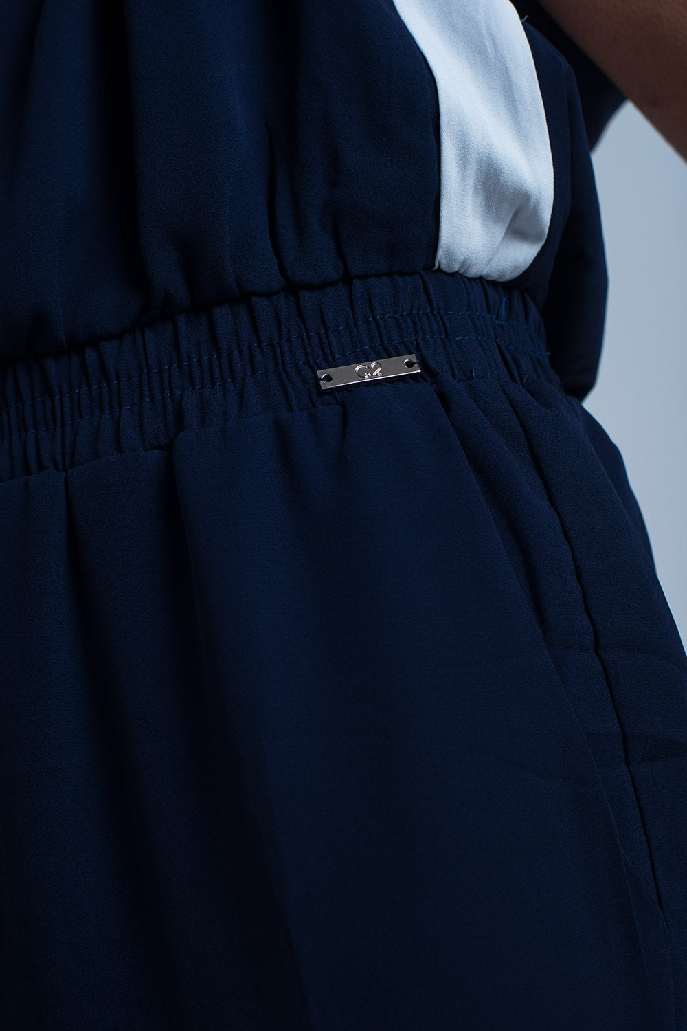 UNIKCOSA Navy blue jumpsuit with short sleeve and ruffle detail