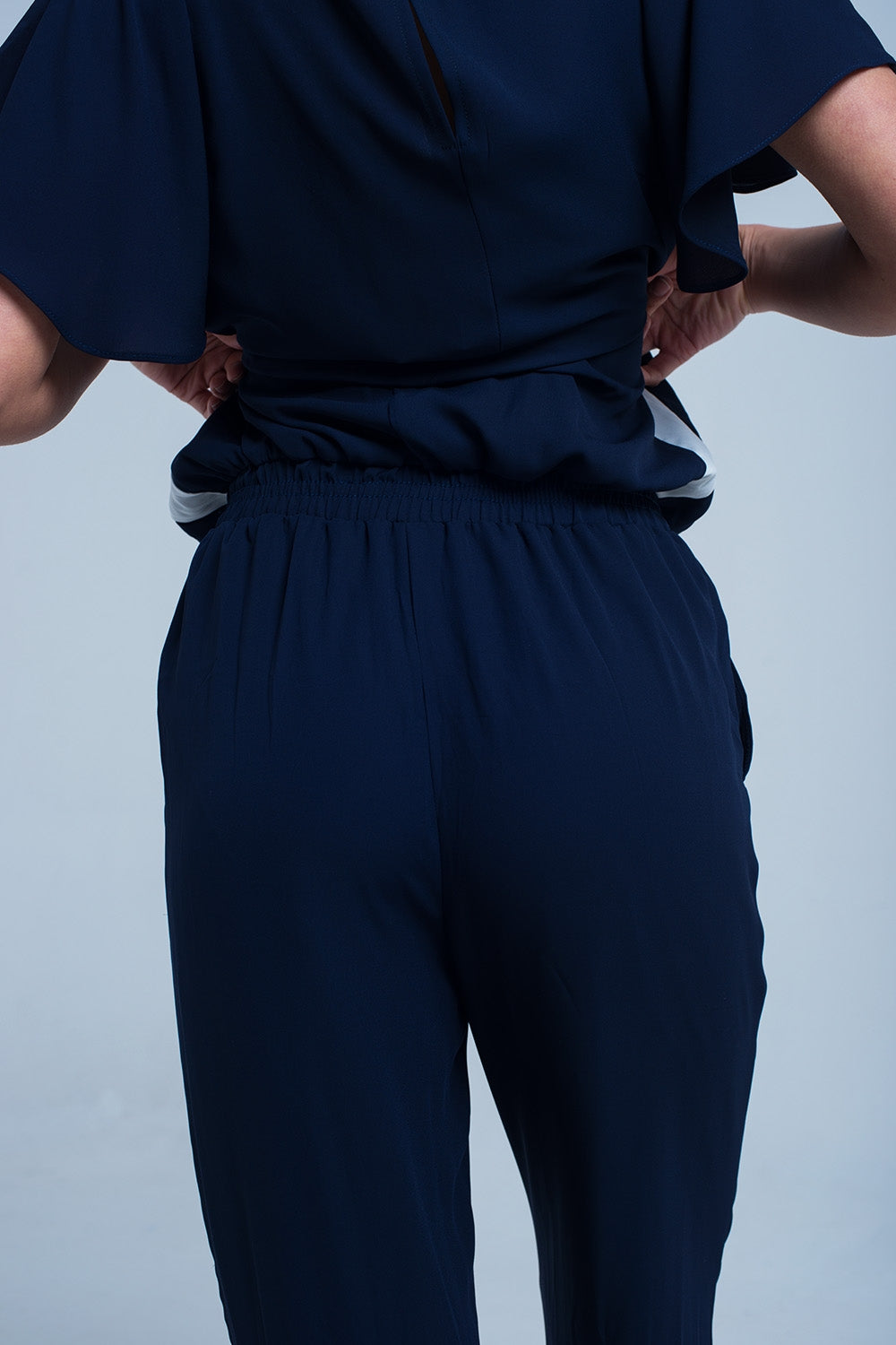 UNIKCOSA Navy blue jumpsuit with short sleeve and ruffle detail