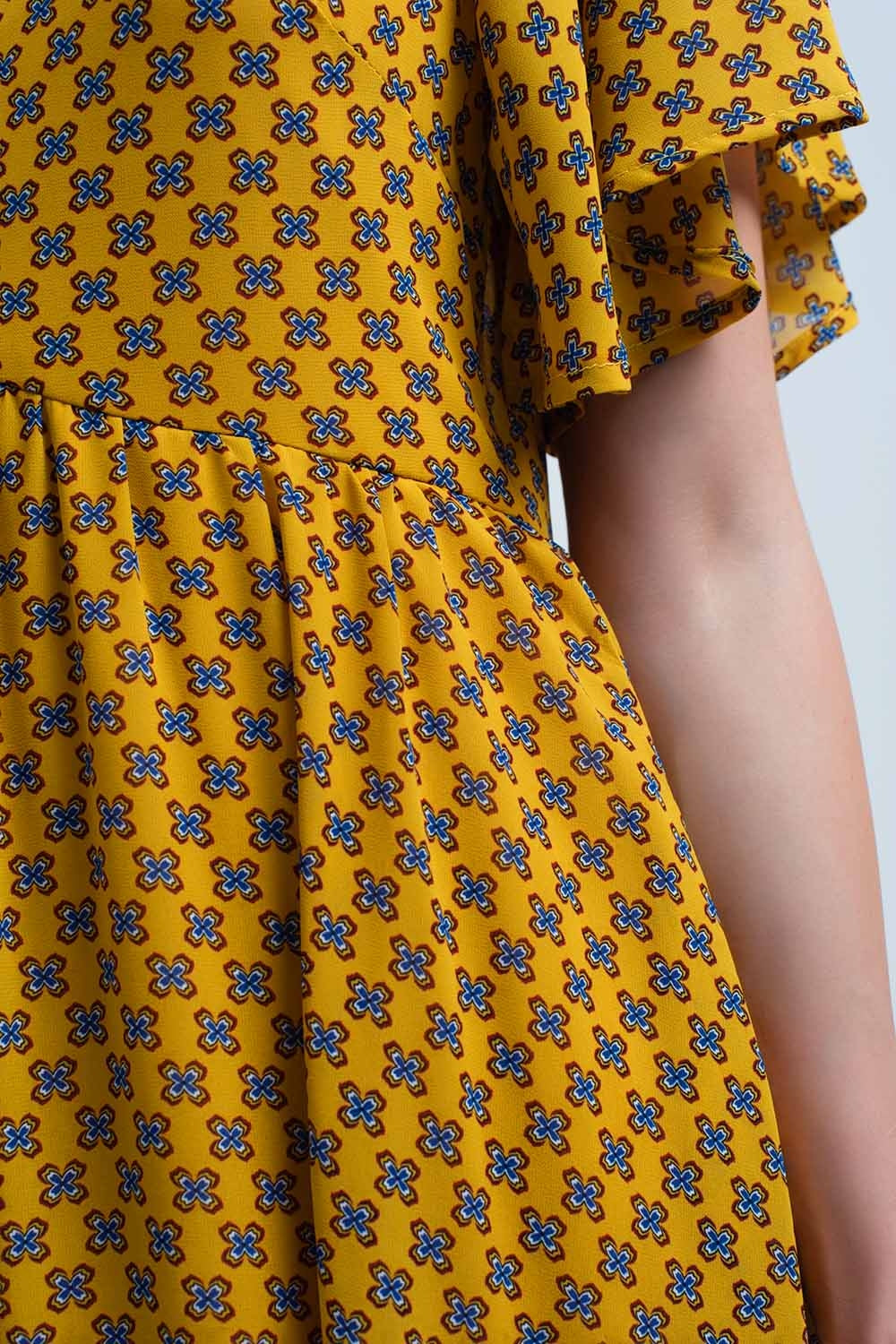 Yellow dress with flight and geometric pattern