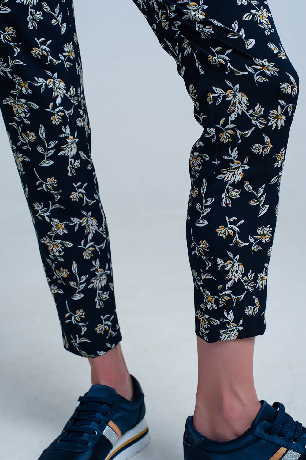 Navy floral pants with a belt