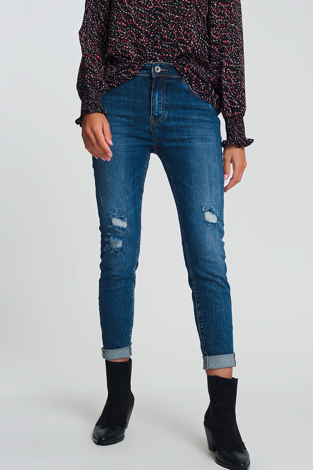 High waisted skinny jeans in dark wash blue with ripped details