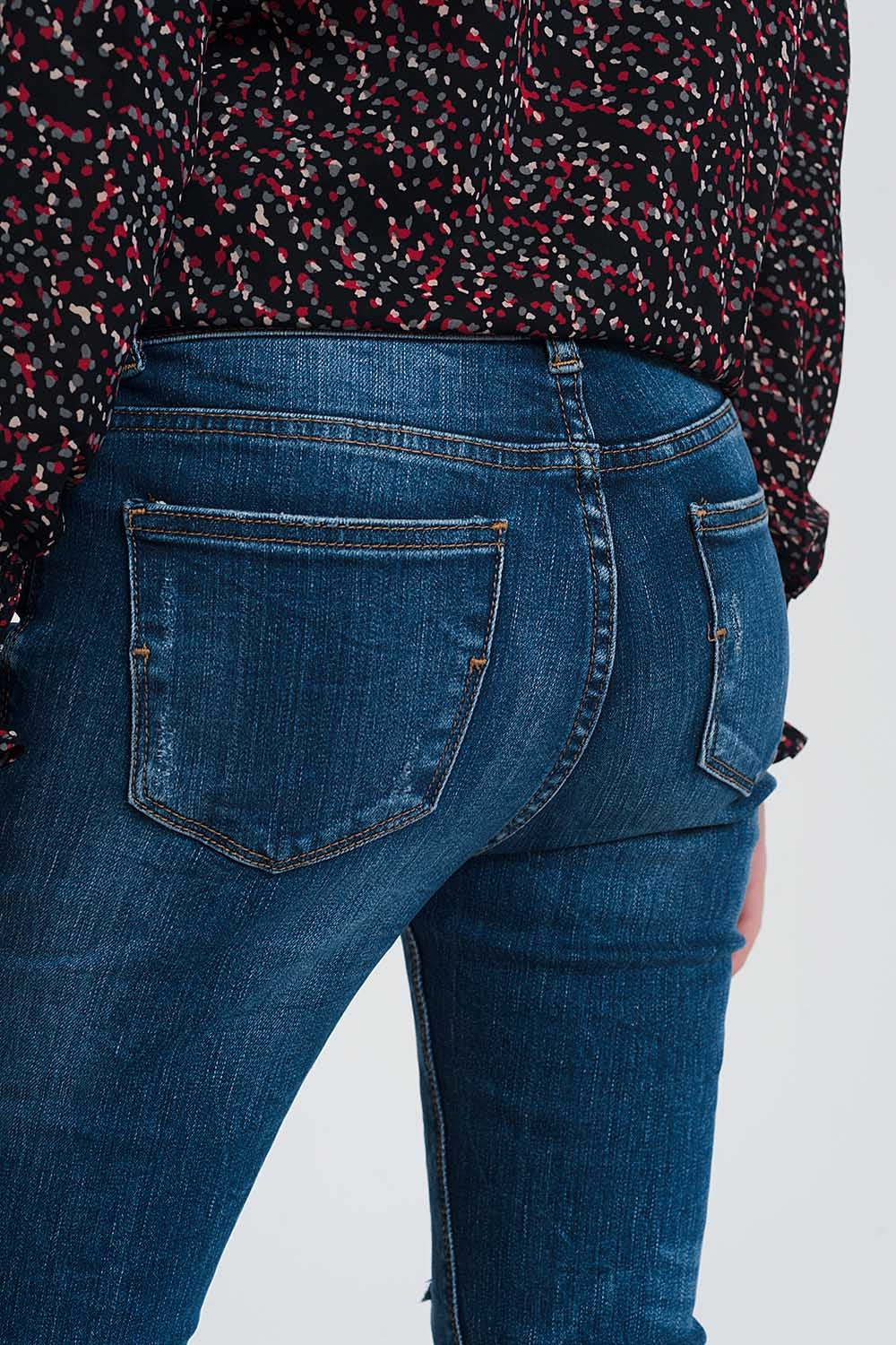 High waisted skinny jeans in dark wash blue with ripped details
