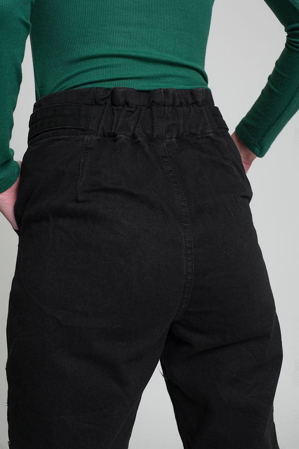 Jeans with paper bag waist and button details in black
