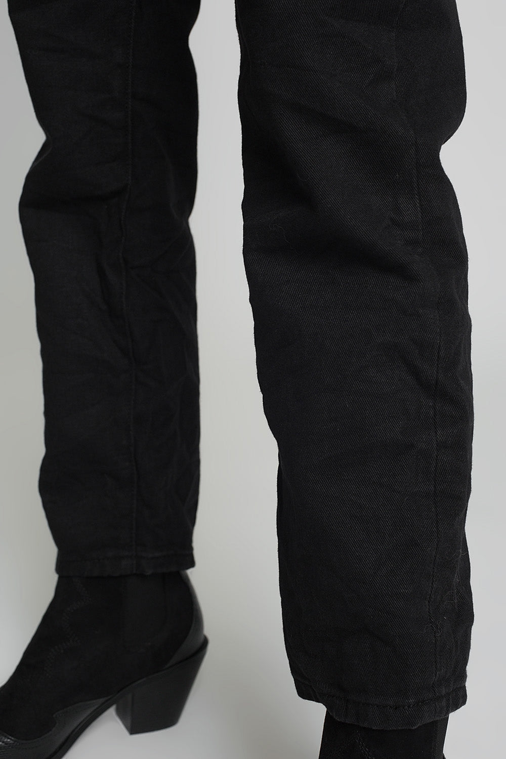 Jeans with paper bag waist and button details in black