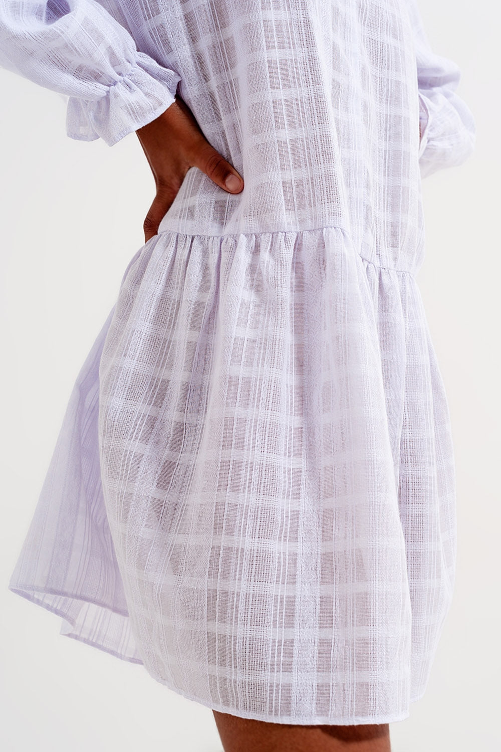 Voluminous mini dress with ruffles in white