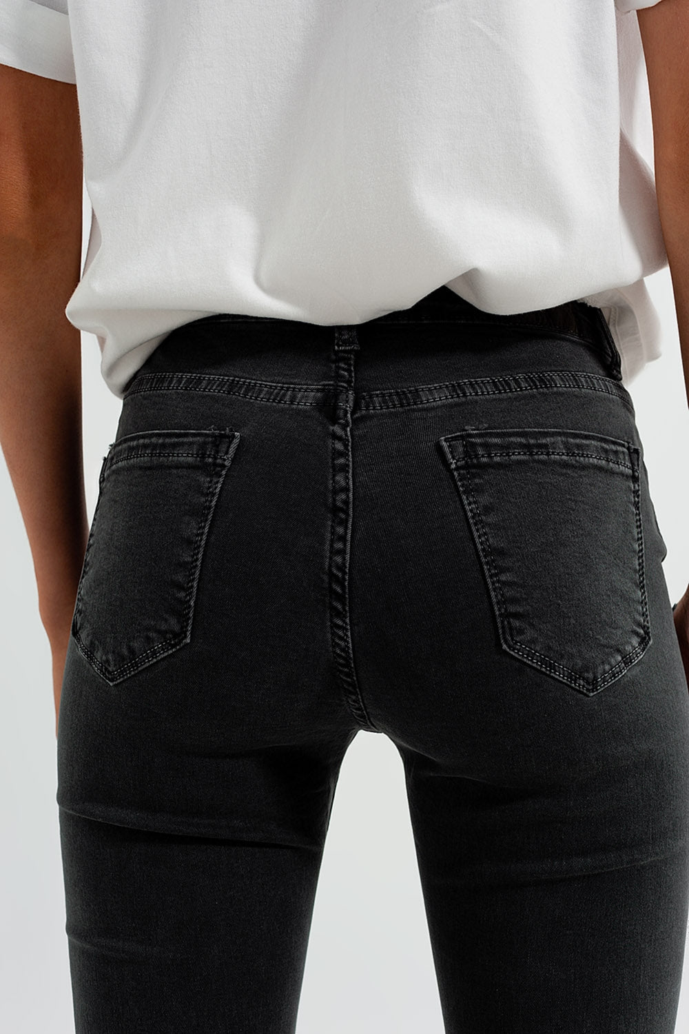 Flare jeans in dark grey with asymmetric detail