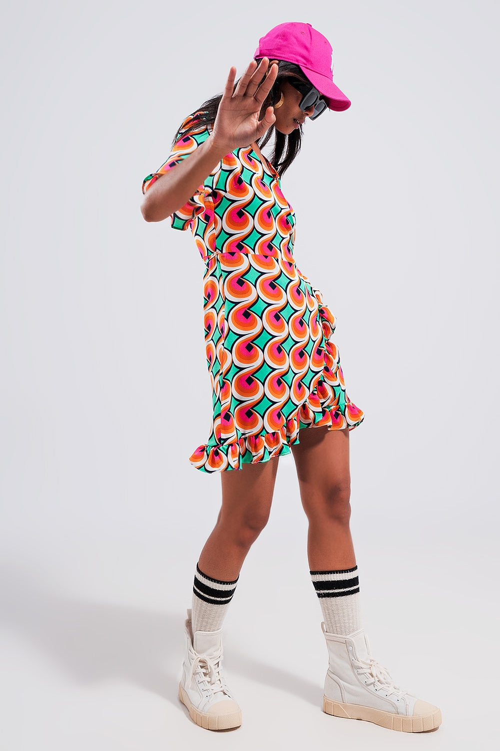 Wrap ruffle hem mini dress in 70s orange print