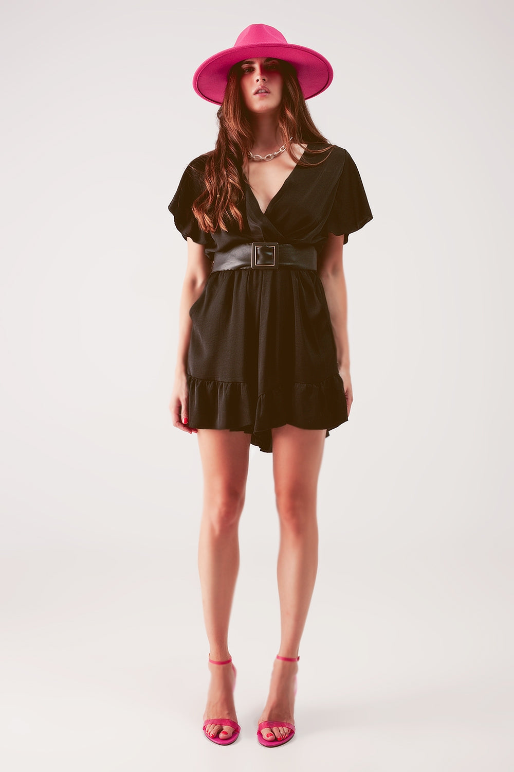 UNIKCOSA Wrap front frill hem jumpsuit in black