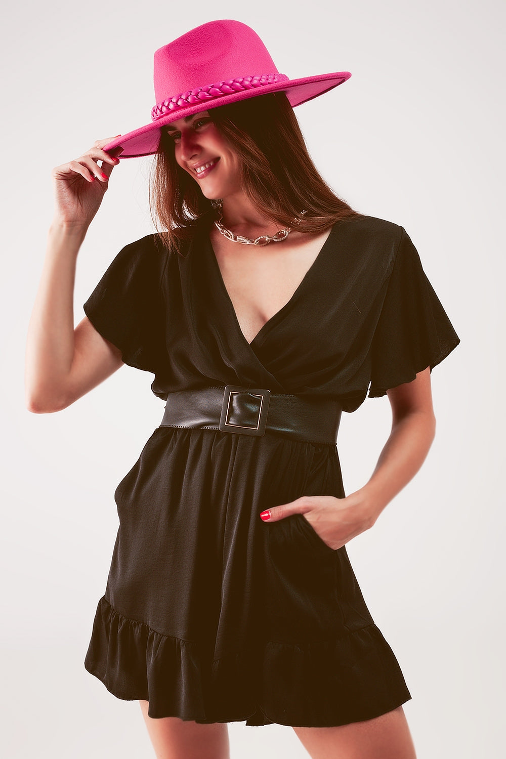UNIKCOSA Wrap front frill hem jumpsuit in black