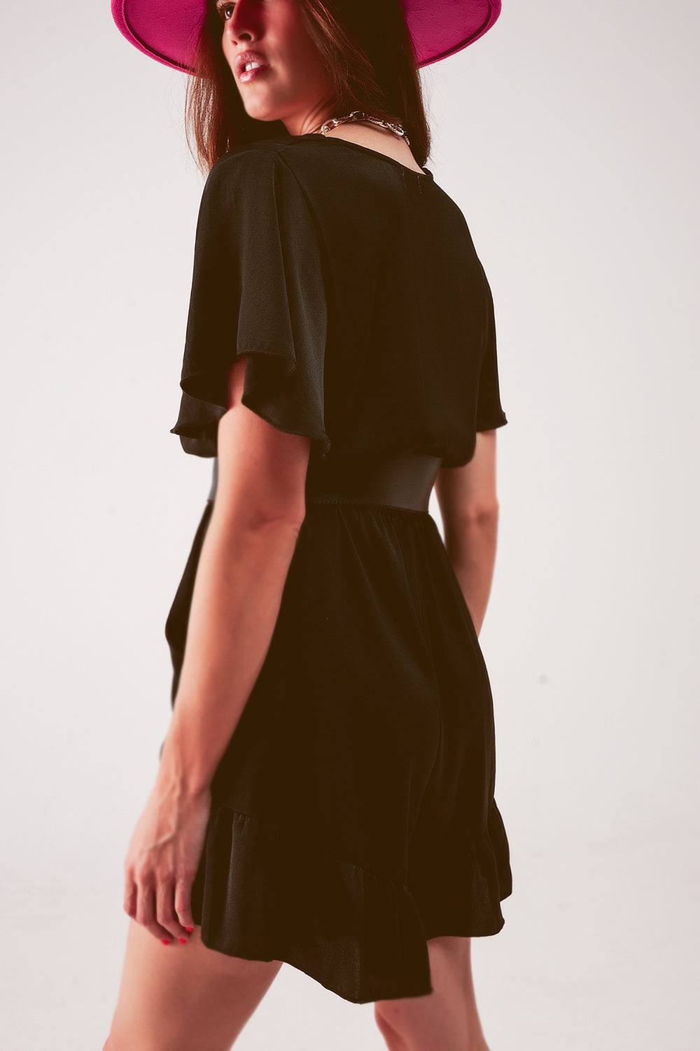 UNIKCOSA Wrap front frill hem jumpsuit in black