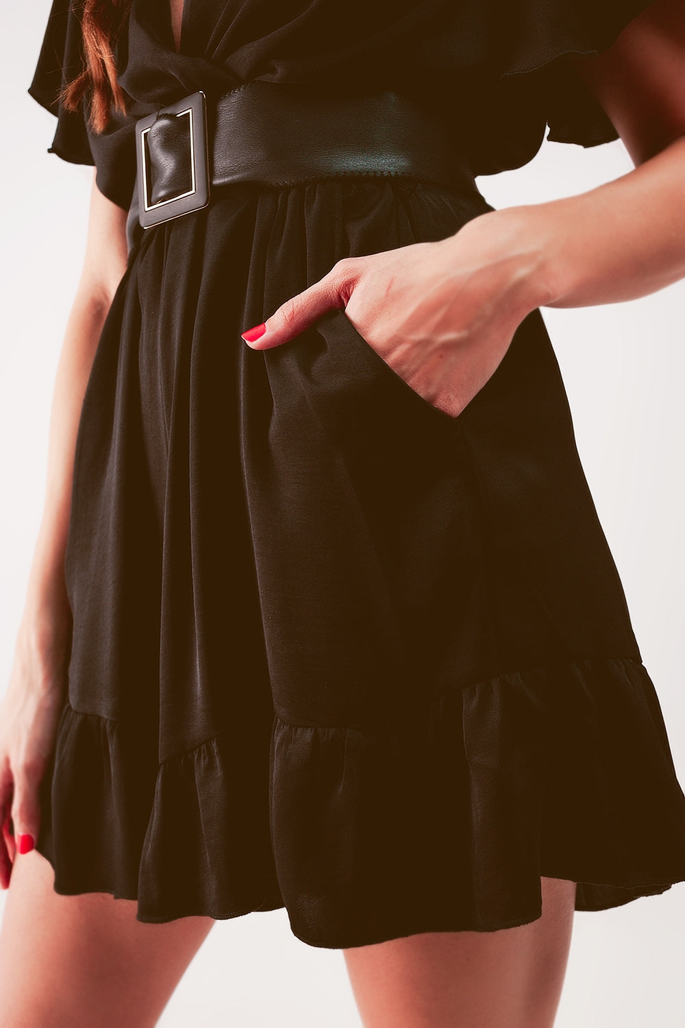 UNIKCOSA Wrap front frill hem jumpsuit in black