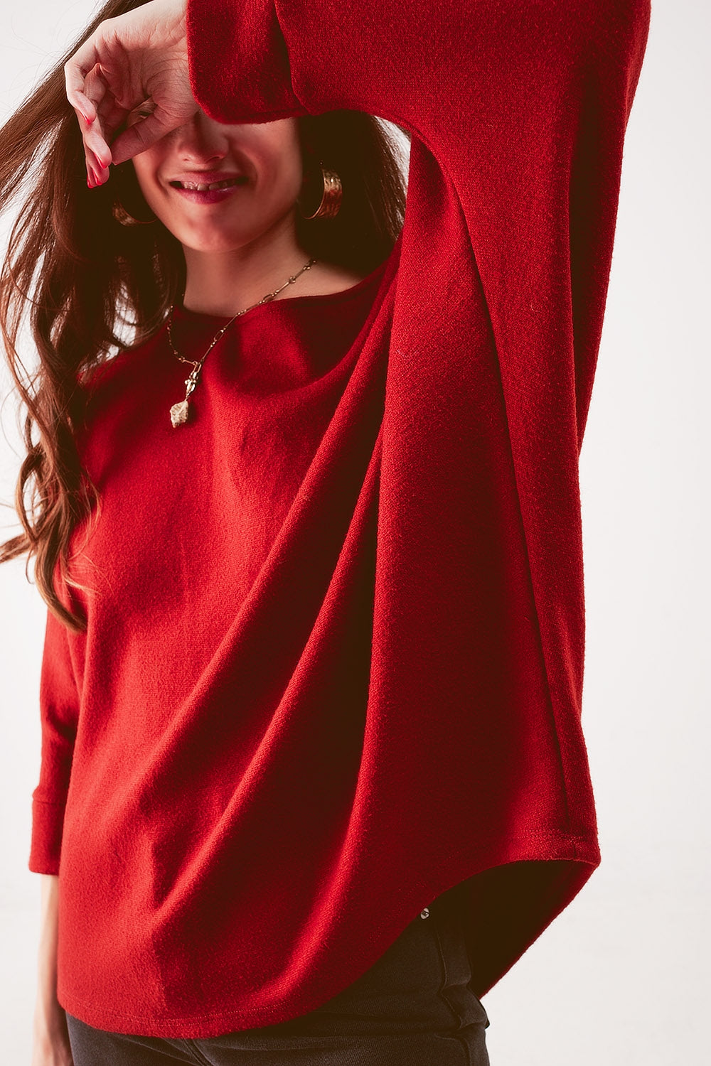 Boat neck batwing sweater in red orange