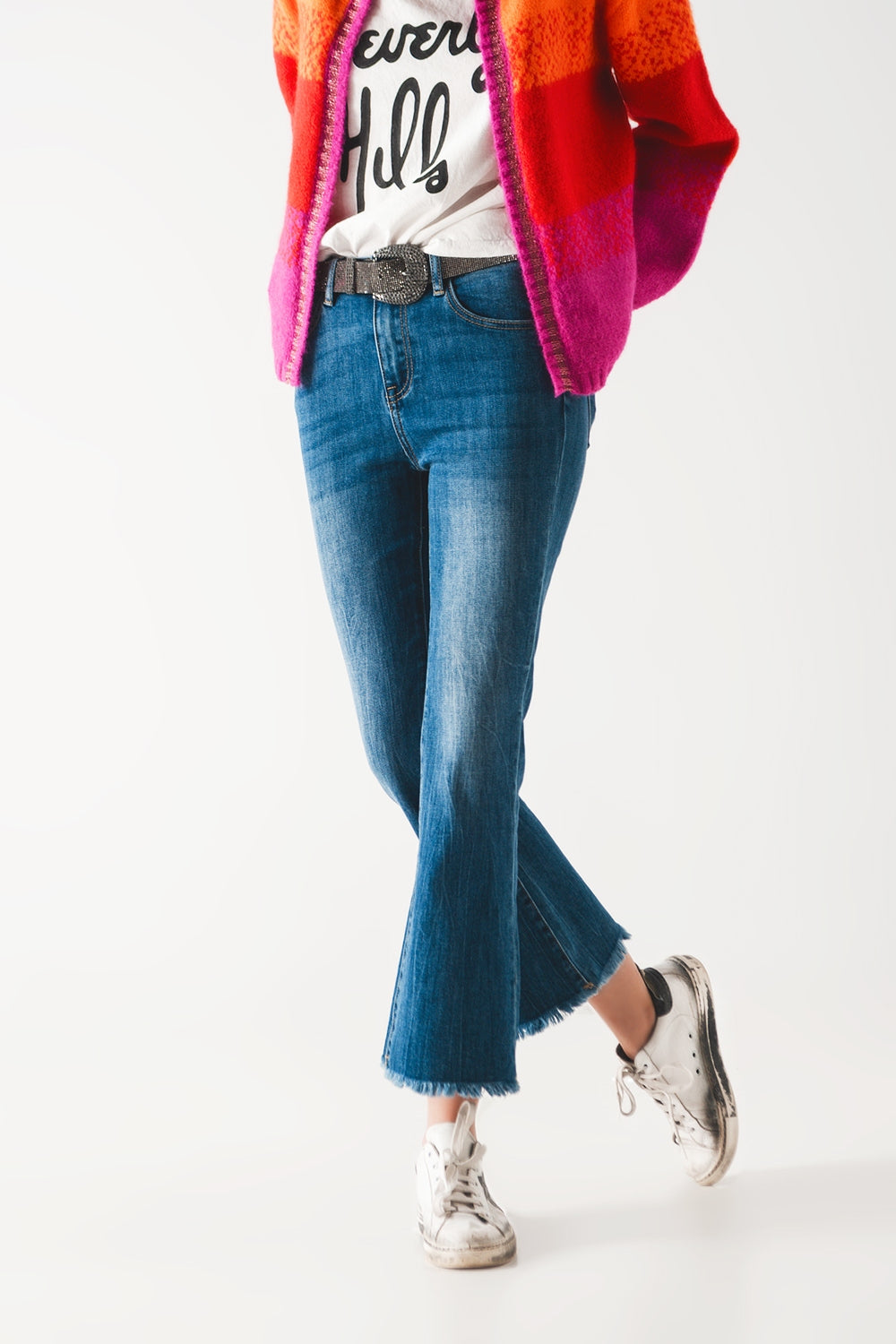 Flared jeans with raw edge in mid wash